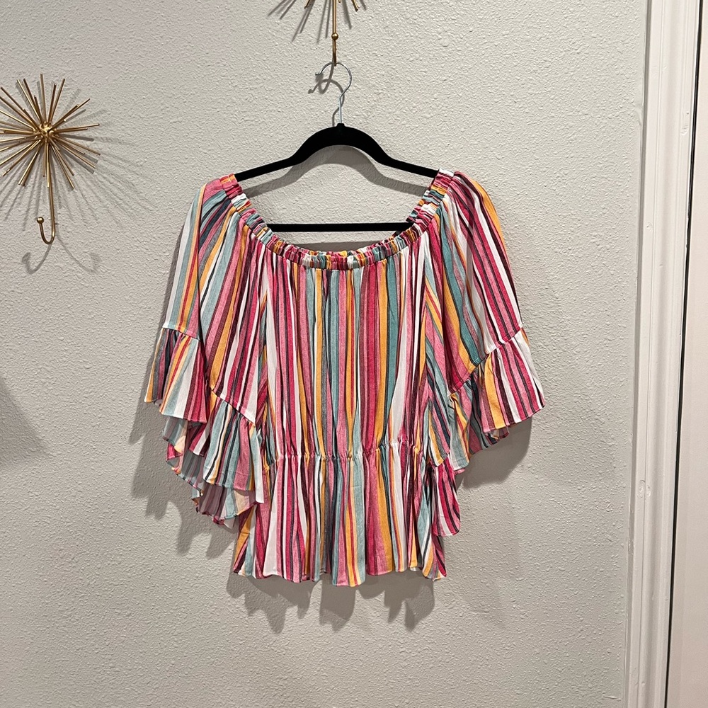 Selling this fun blouse that is off the shoulders